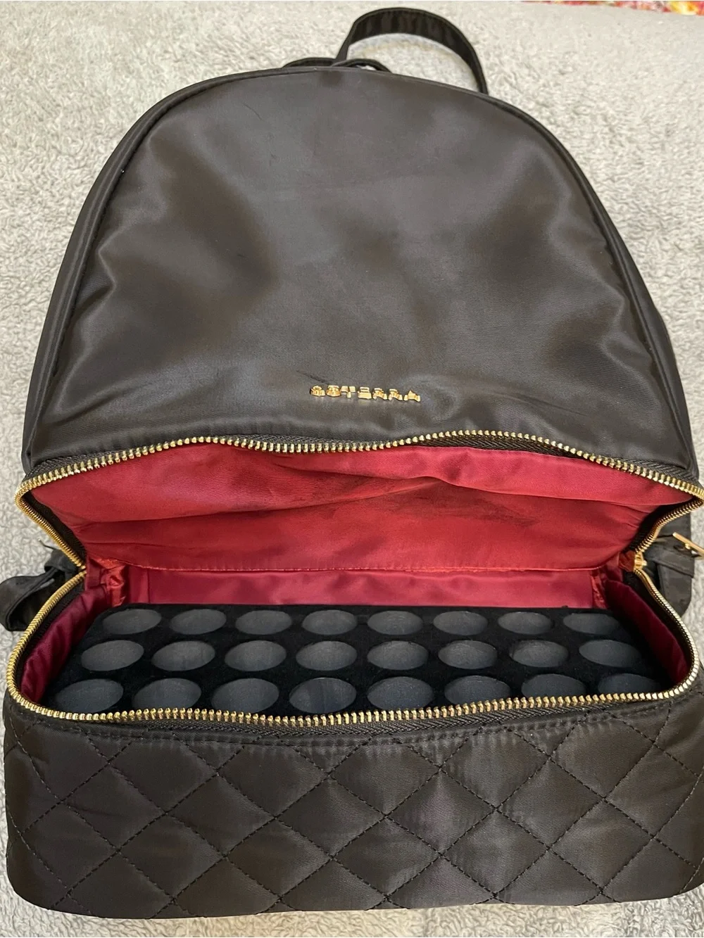 Doterra Black Quilted-Bottom Backpack with Gold Accents